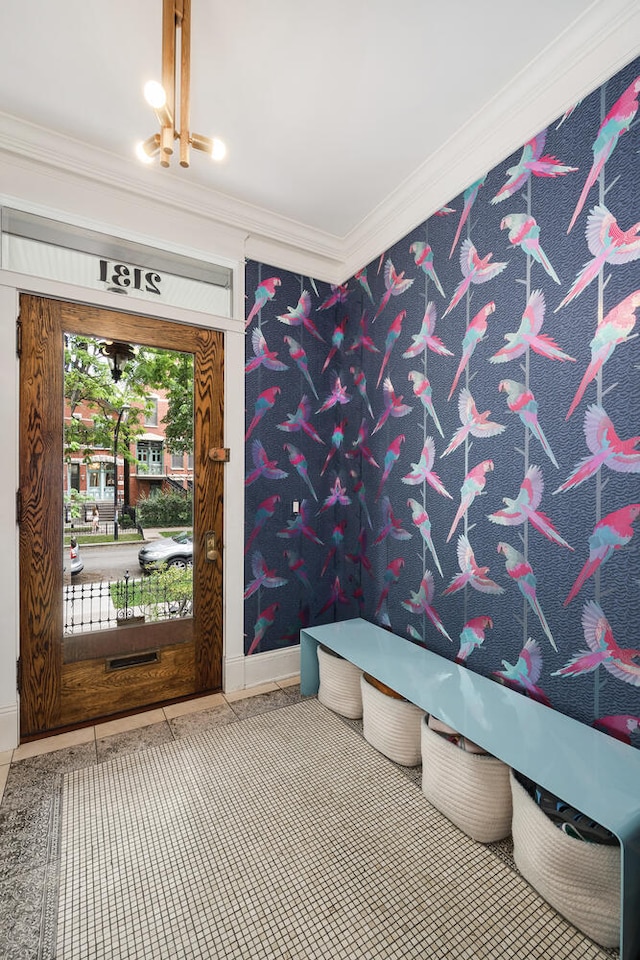 2131 W Schiller St, Chicago, IL 60622 - tiled entrance foyer with crown molding and a chandelier