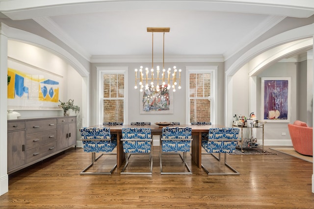2131 W Schiller St, Chicago, IL 60622 - dining area featuring crown molding, wood finished floors, and arched walkways