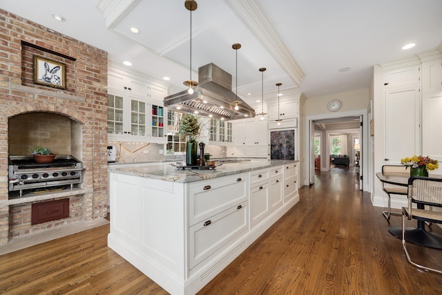 2131 W Schiller St, Chicago, IL 60622 - kitchen featuring island exhaust hood, dark wood-style floors, glass insert cabinets, white cabinets, and recessed lighting