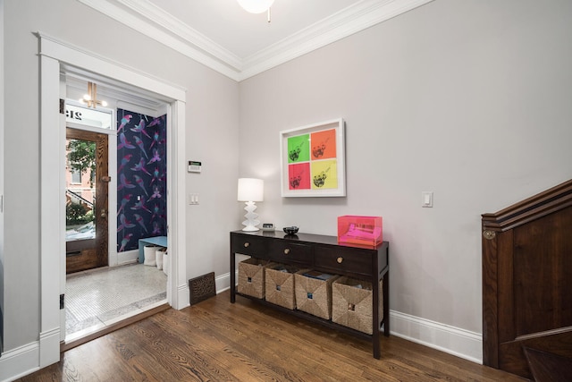 2131 W Schiller St, Chicago, IL 60622 - entrance foyer with wood finished floors, crown molding, and a chandelier