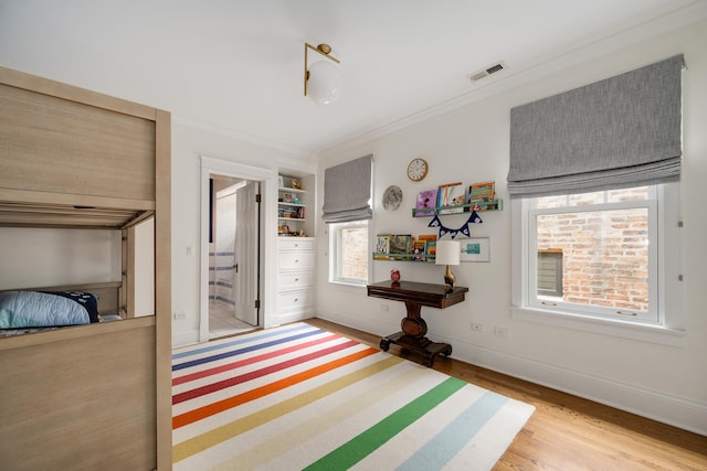2131 W Schiller St, Chicago, IL 60622 - bedroom featuring crown molding and wood finished floors
