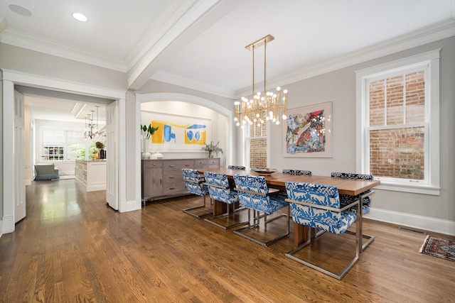 2131 W Schiller St, Chicago, IL 60622 - dining room with a chandelier, crown molding, wood finished floors, and arched walkways
