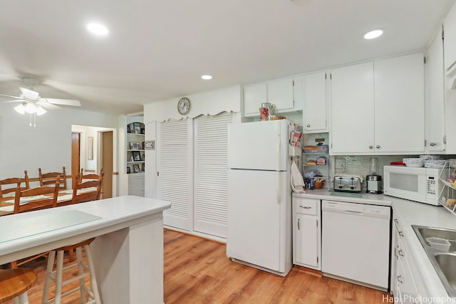 3914 N Richmond Rd, Johnsburg, IL 60051 - kitchen with white appliances, light countertops, ceiling fan, light wood-style floors, and recessed lighting