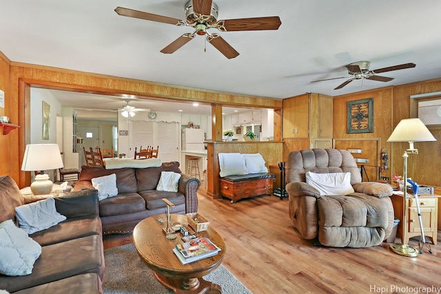 3914 N Richmond Rd, Johnsburg, IL 60051 - living room featuring a ceiling fan, light wood finished floors, and wooden walls