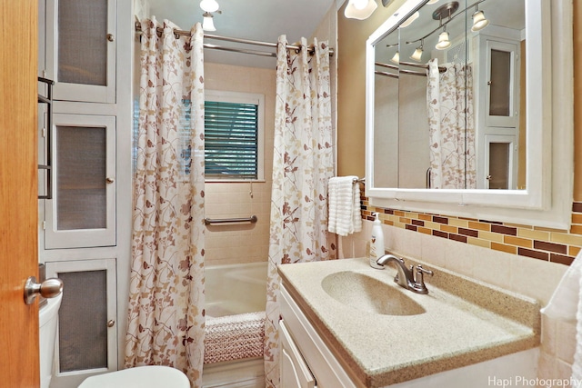 3914 N Richmond Rd, Johnsburg, IL 60051 - bathroom with shower / bathtub combination with curtain, vanity, decorative backsplash, and tile walls