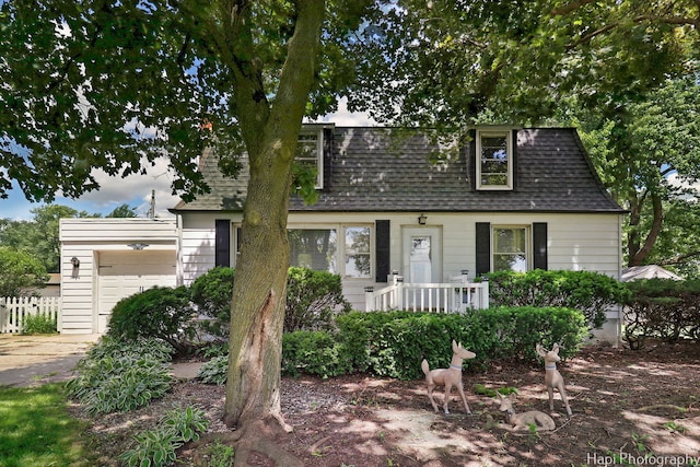 3914 N Richmond Rd, Johnsburg, IL 60051 - view of front facade featuring a shingled roof, a garage, driveway, and mansard roof