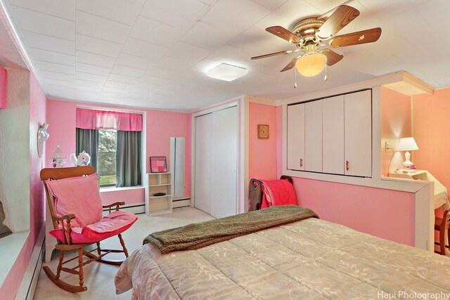 3914 N Richmond Rd, Johnsburg, IL 60051 - bedroom featuring a baseboard heating unit, carpet, and ceiling fan