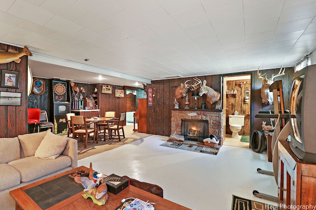 3914 N Richmond Rd, Johnsburg, IL 60051 - living room featuring wood walls and a stone fireplace