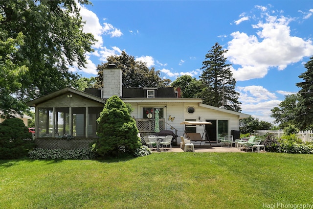 3914 N Richmond Rd, Johnsburg, IL 60051 - back of property featuring a patio area, a chimney, and a yard