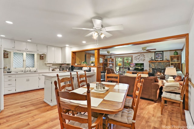 3914 N Richmond Rd, Johnsburg, IL 60051 - dining room featuring light wood-style floors, ceiling fan, recessed lighting, and a fireplace