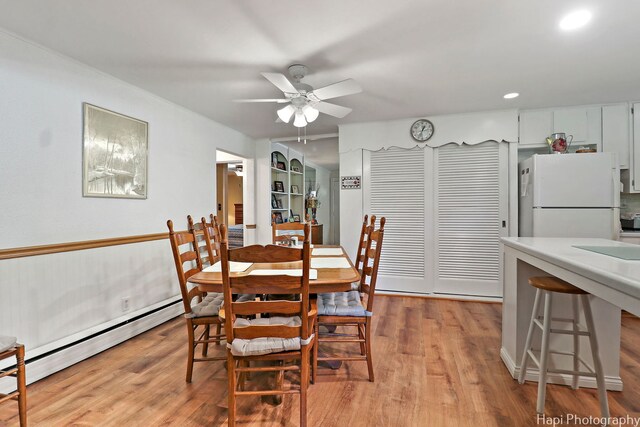 3914 N Richmond Rd, Johnsburg, IL 60051 - dining area featuring a baseboard radiator, ceiling fan, light wood-style flooring, and recessed lighting