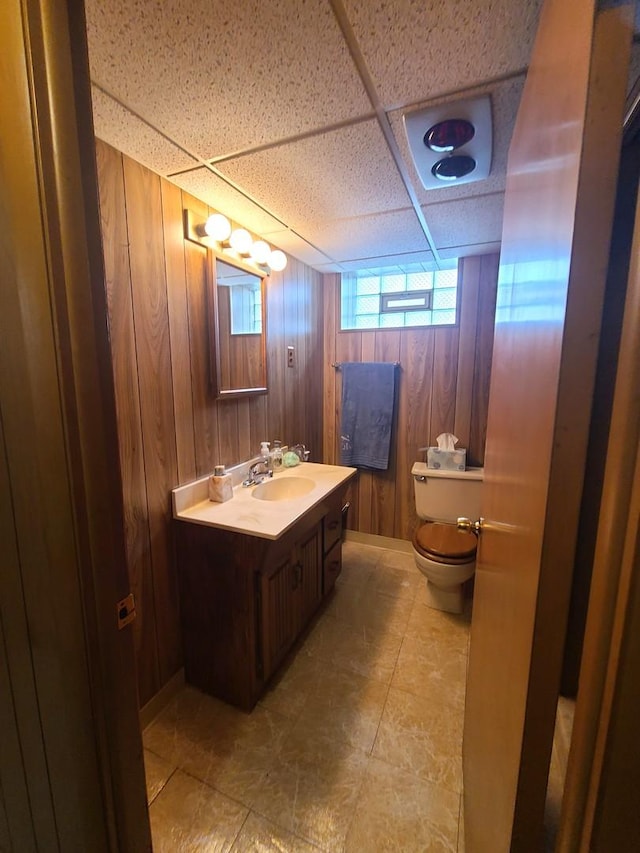3623 Hawthorne St, Franklin Park, IL 60131 - half bathroom with vanity, wooden walls, and a paneled ceiling