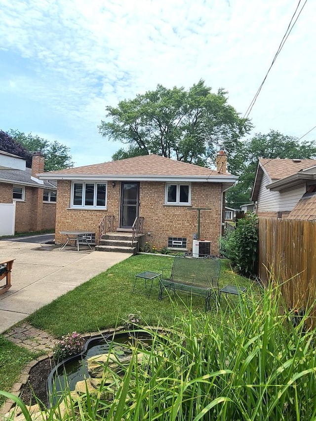 3623 Hawthorne St, Franklin Park, IL 60131 - back of house with brick siding, entry steps, a patio area, and a chimney