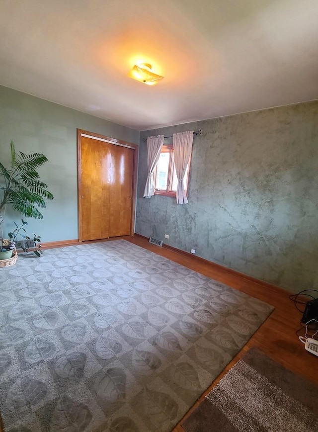 3623 Hawthorne St, Franklin Park, IL 60131 - unfurnished bedroom featuring wood finished floors
