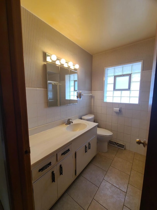 3623 Hawthorne St, Franklin Park, IL 60131 - bathroom with vanity, tile patterned flooring, and tile walls