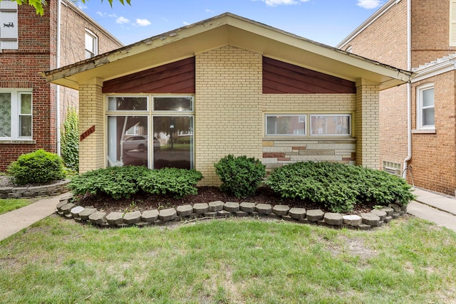 8716 S Merrill Ave, Chicago, IL 60617 - view of side of property with brick siding and a yard