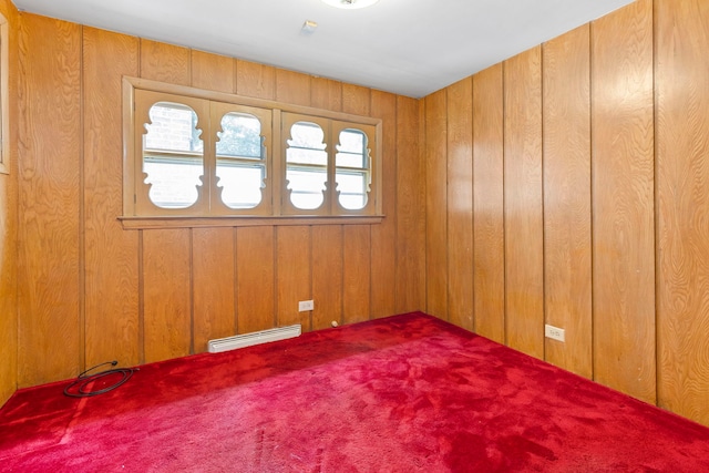 8716 S Merrill Ave, Chicago, IL 60617 - carpeted empty room with a baseboard radiator and wood walls