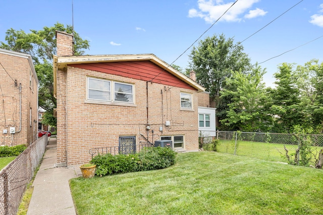 8716 S Merrill Ave, Chicago, IL 60617 - rear view of house featuring a chimney and brick siding