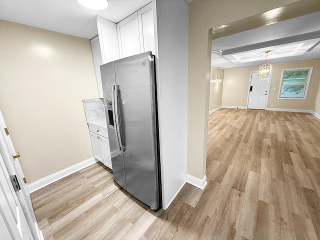16802 Anthony Ave, Hazel Crest, IL 60429 - kitchen featuring stainless steel fridge with ice dispenser, light wood-type flooring, white cabinetry, and light countertops