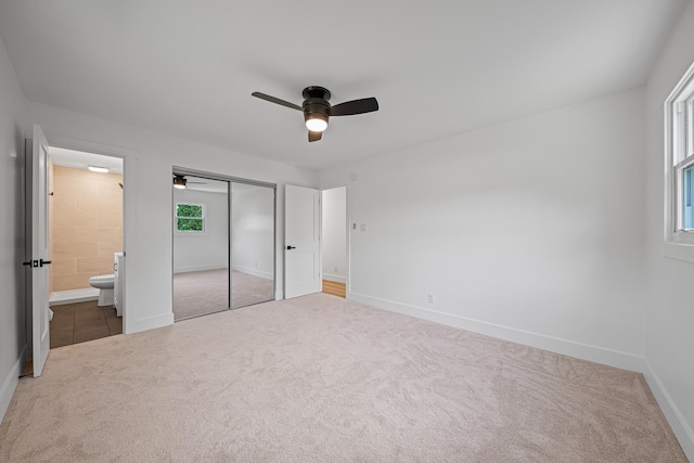214 Somerset Ct, New Lenox, IL 60451 - unfurnished bedroom with carpet flooring, ensuite bathroom, a closet, and a ceiling fan