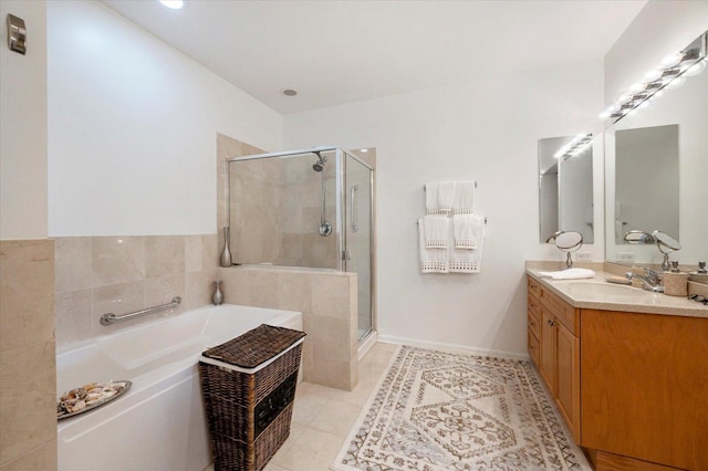 1700 Riverwoods Dr Unit 520, Melrose Park, IL 60160 - full bathroom featuring a bath, a shower stall, double vanity, and tile patterned flooring