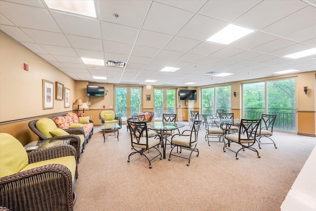 1700 Riverwoods Dr Unit 520, Melrose Park, IL 60160 - dining space featuring healthy amount of natural light, a paneled ceiling, and carpet