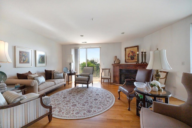 1700 Riverwoods Dr Unit 520, Melrose Park, IL 60160 - living area featuring light wood-type flooring and a fireplace
