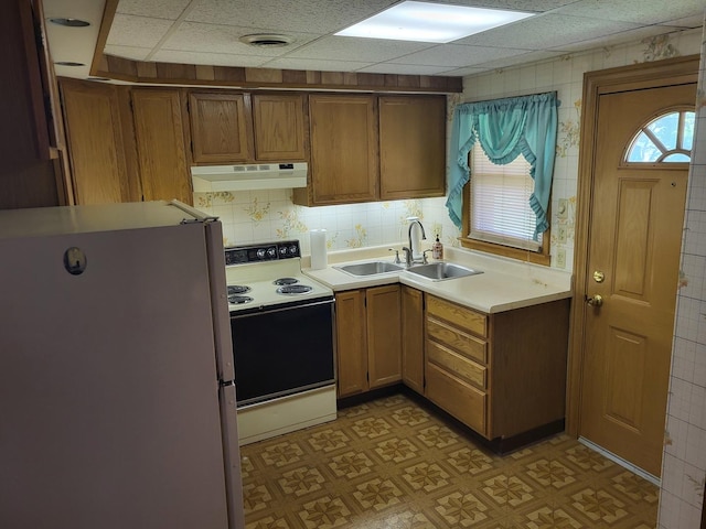 3021 N Prater Ave, Melrose Park, IL 60164 - kitchen featuring white appliances, under cabinet range hood, light countertops, light flooring, and brown cabinetry