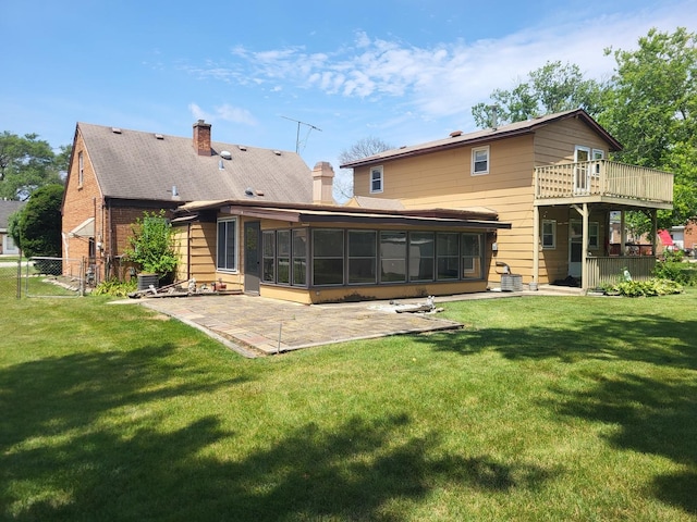3021 N Prater Ave, Melrose Park, IL 60164 - back of house with a patio, a sunroom, and a chimney