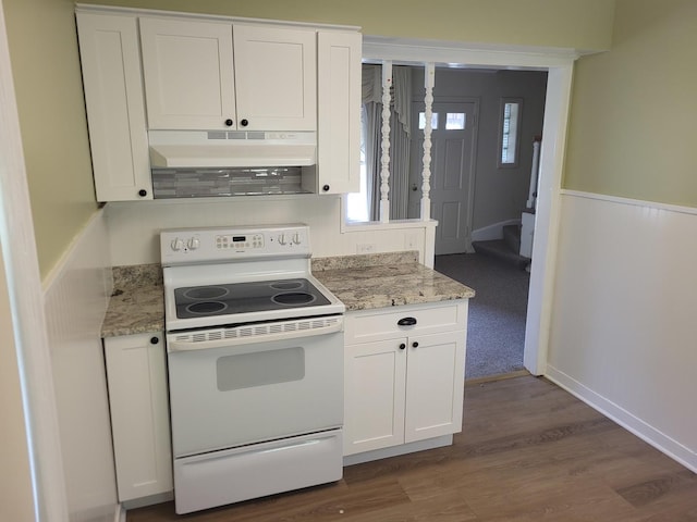 3021 N Prater Ave, Melrose Park, IL 60164 - kitchen with white electric stove, under cabinet range hood, white cabinetry, and light stone countertops