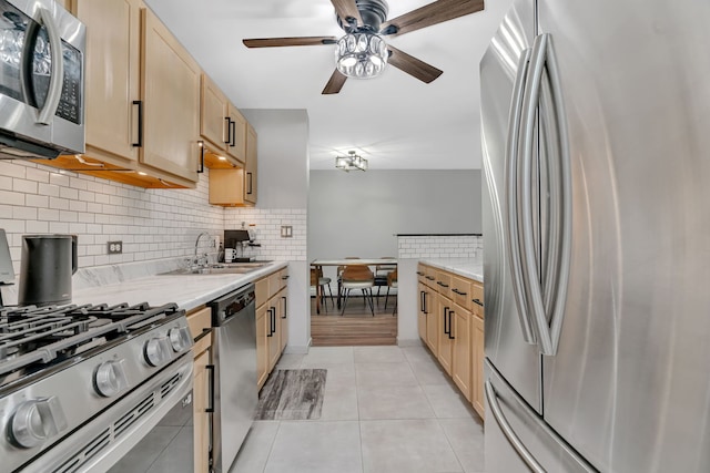520 Burning Tree Ln Unit 306, Naperville, IL 60563 - kitchen with appliances with stainless steel finishes, light brown cabinetry, a ceiling fan, and tasteful backsplash