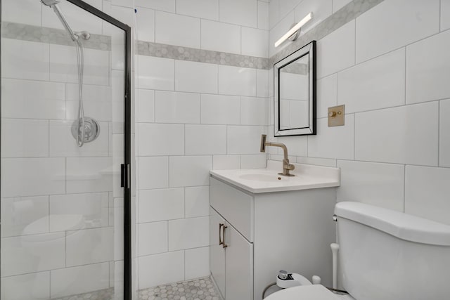 520 Burning Tree Ln Unit 306, Naperville, IL 60563 - bathroom with tile walls, a stall shower, vanity, and backsplash