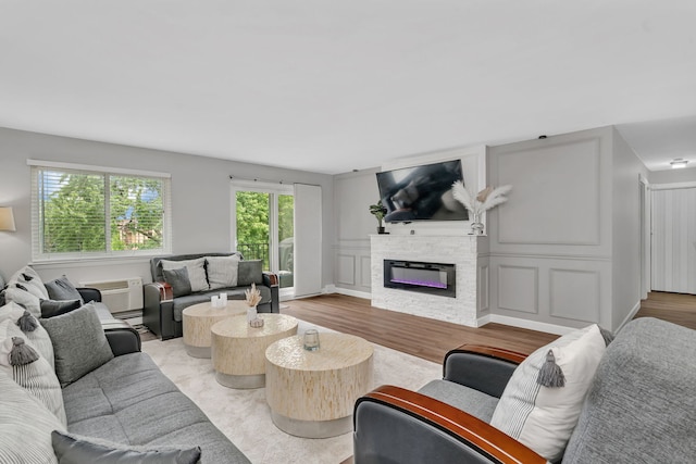520 Burning Tree Ln Unit 306, Naperville, IL 60563 - living area featuring a fireplace and light wood-style floors