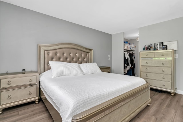 520 Burning Tree Ln Unit 306, Naperville, IL 60563 - bedroom featuring wood finished floors and a spacious closet