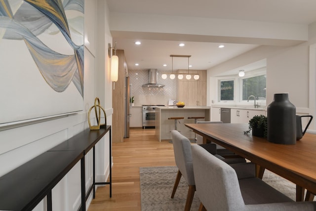 5309 Crain St, Skokie, IL 60077 - dining area with light wood-style flooring and recessed lighting