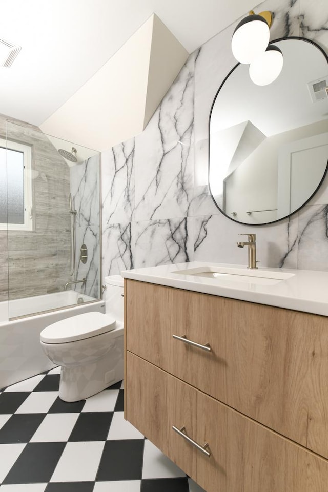 5309 Crain St, Skokie, IL 60077 - bathroom featuring tile patterned floors, vanity, and shower / bath combination