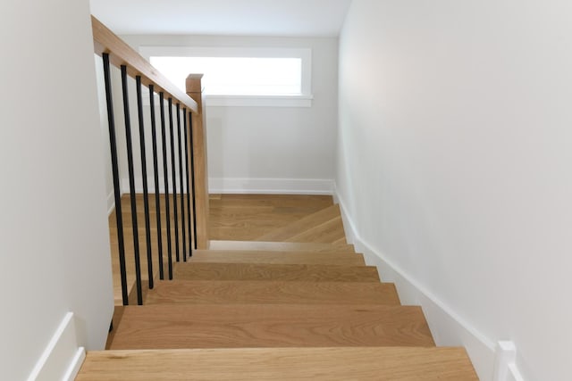 5309 Crain St, Skokie, IL 60077 - staircase with wood finished floors and baseboards