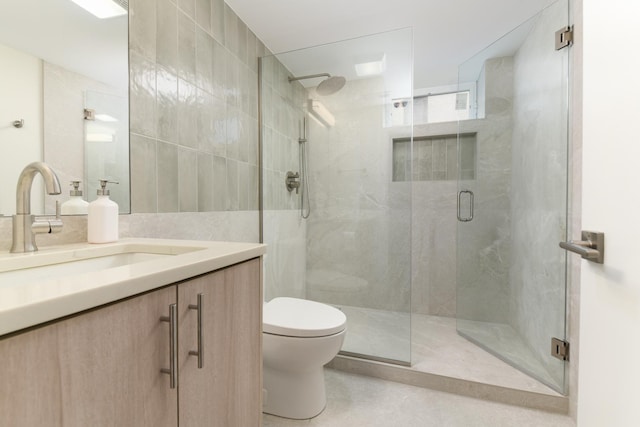 5309 Crain St, Skokie, IL 60077 - bathroom with a shower stall, vanity, and tile walls