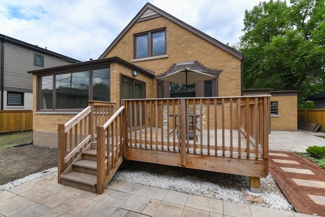 5309 Crain St, Skokie, IL 60077 - rear view of house with brick siding and a deck