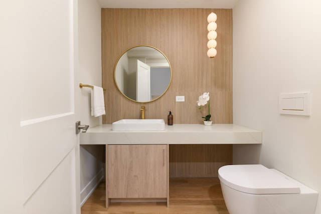 5309 Crain St, Skokie, IL 60077 - half bathroom featuring wood finished floors and vanity