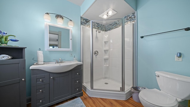 123 E 3rd St, Byron, IL 61010 - bathroom featuring a shower stall, wood finished floors, and vanity