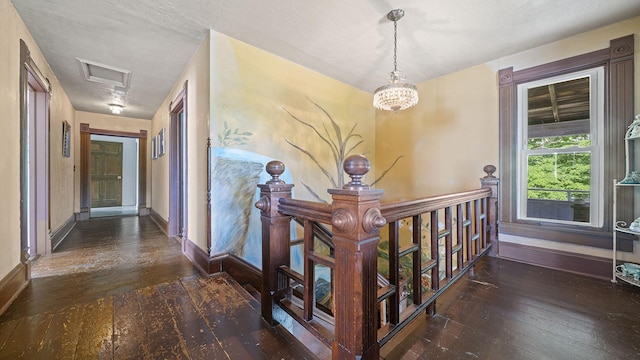 123 E 3rd St, Byron, IL 61010 - hallway featuring hardwood / wood-style floors, attic access, a chandelier, and an upstairs landing