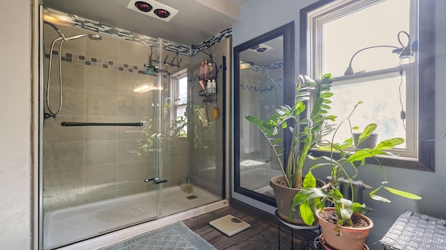 123 E 3rd St, Byron, IL 61010 - full bathroom featuring a shower stall and wood finished floors