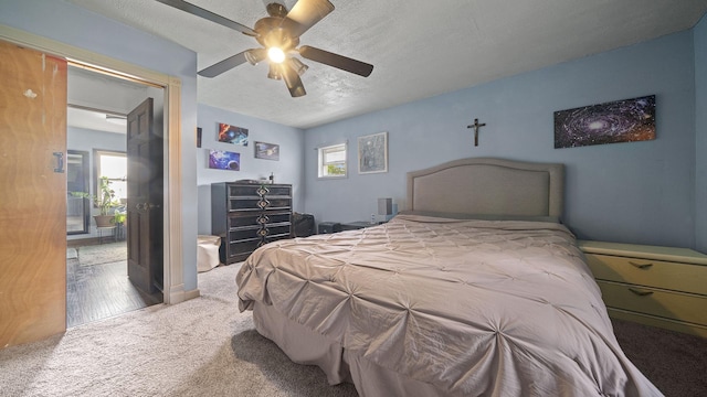 123 E 3rd St, Byron, IL 61010 - carpeted bedroom with ceiling fan and a textured ceiling