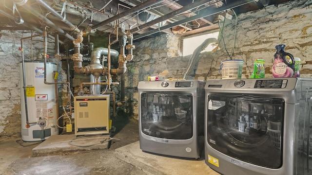 123 E 3rd St, Byron, IL 61010 - laundry room featuring gas water heater, washing machine and dryer, and a heating unit