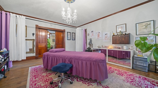 123 E 3rd St, Byron, IL 61010 - bedroom featuring crown molding, a chandelier, and wood finished floors
