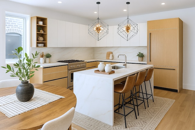 1325 N Artesian Ave Unit 3, Chicago, IL 60622 - kitchen with premium appliances, light countertops, modern cabinets, and recessed lighting
