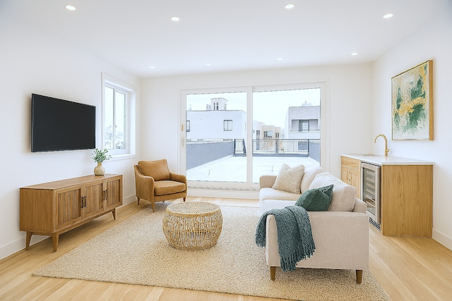 1325 N Artesian Ave Unit 3, Chicago, IL 60622 - living area with beverage cooler, light wood-style floors, recessed lighting, and bar with sink