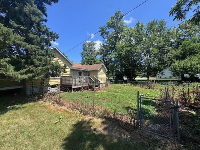 203 N Center St, Colfax, IL 61728 - view of yard featuring a deck