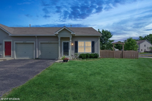2715 Hoffman St, Plano, IL 60545 - single story home featuring a garage, asphalt driveway, and a shingled roof